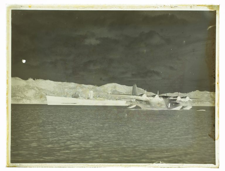 (View of Merchant Freighter and Sunderland Air force One plane)